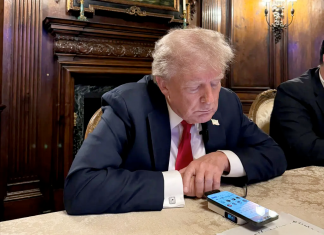 Trump uses Chinese powerbank & microphone to talk to Musk