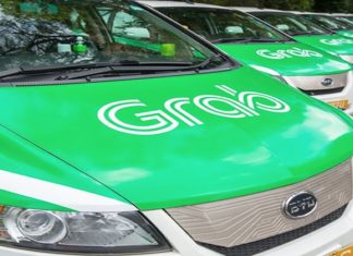 Why did Grab acquire a taxi license in Singapore?